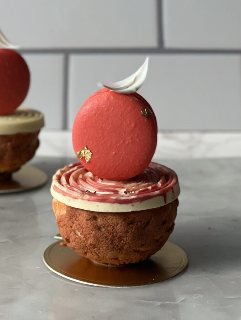 choux puff on a plate decorated with chocolate and more