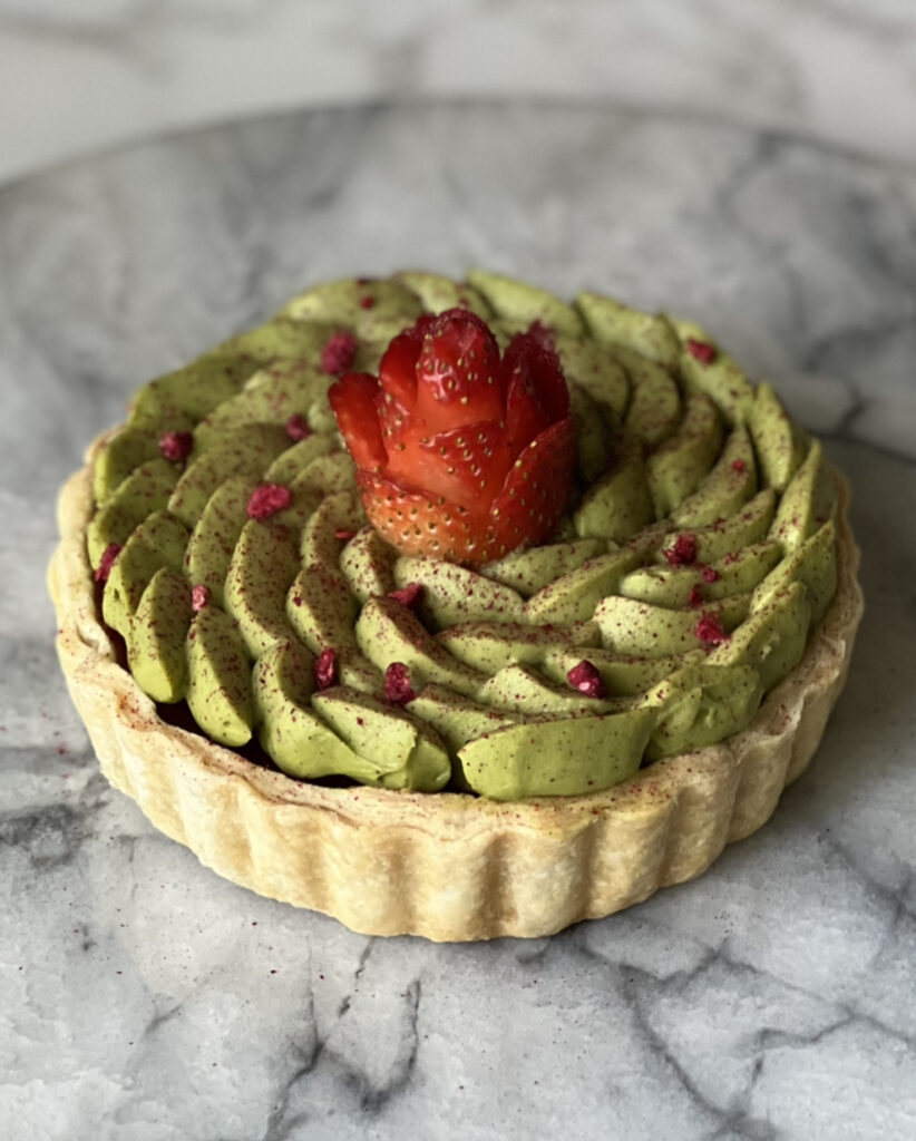 a matcha tart on a marble countertop 