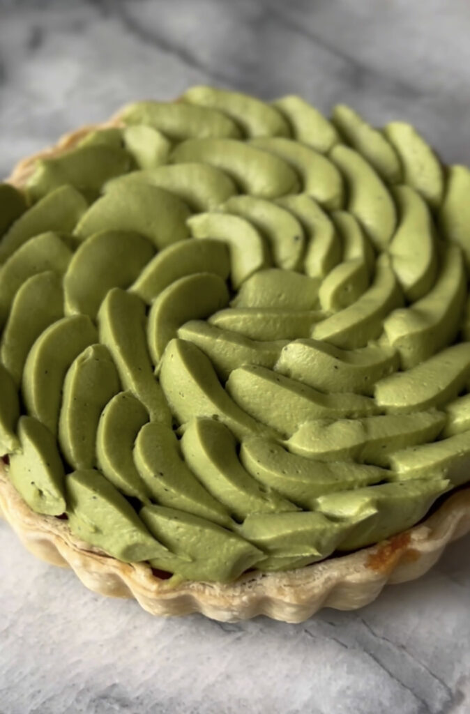 matcha whipped ganache piped on top of a tart